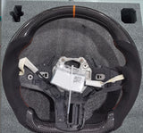 BMW G8X G2X  C.F STEERING WHEEL WITH ORANGE STRIPE AND STITCHING ( PREORDER)